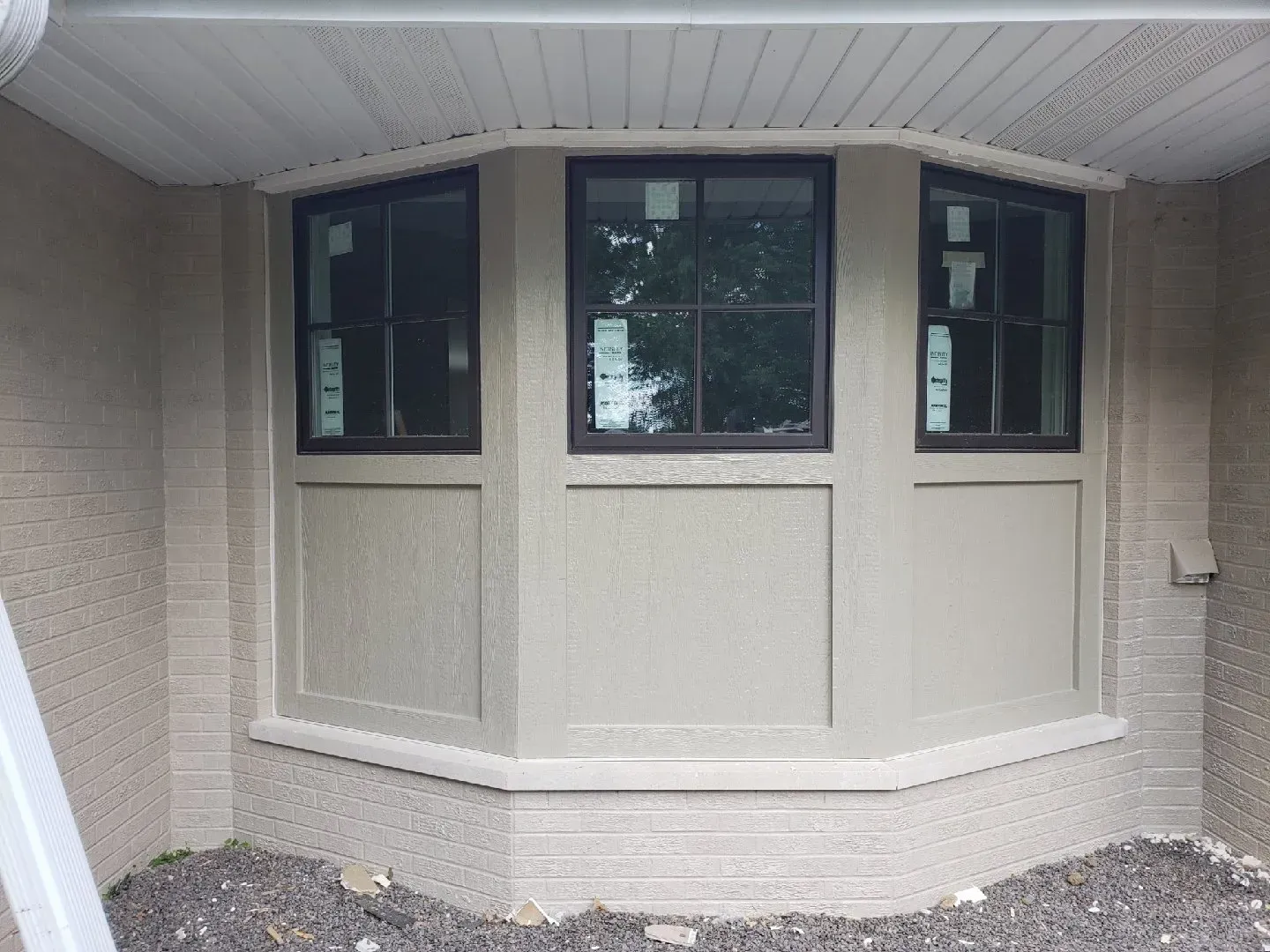 A bay window is being built on the side of a house.