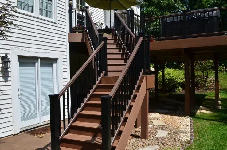 A wooden deck with stairs leading up to it