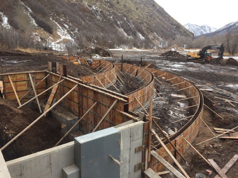 A construction site with a mountain in the background