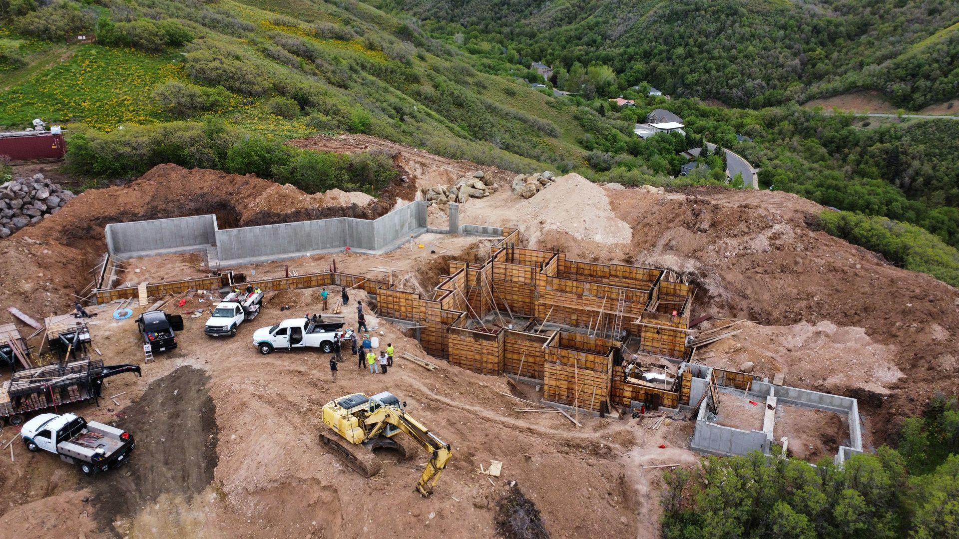 An aerial view of a construction site on top of a hill