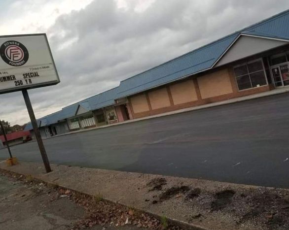 An empty store front with a sign that says entrance special