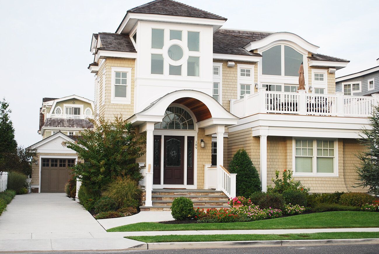 A large house with a lot of windows and a balcony