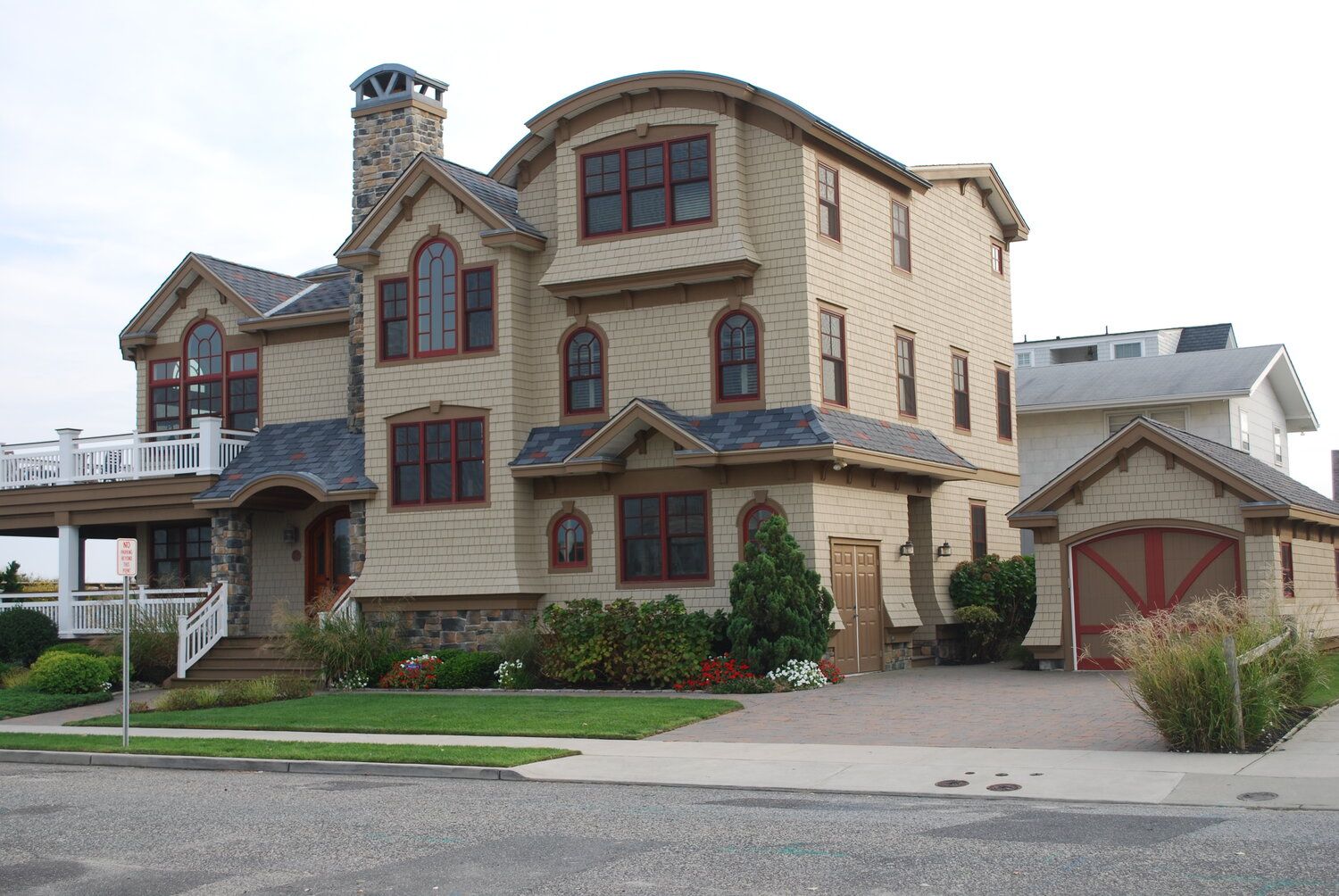 A large house with a garage in front of it
