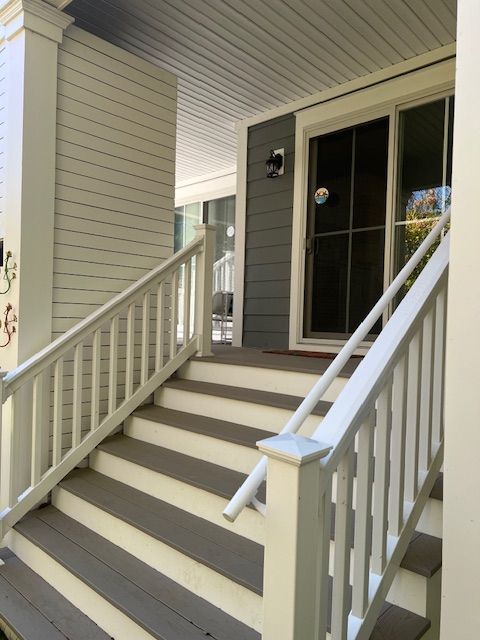 Stairs leading up to the front door of a house