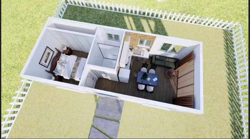 An aerial view of a small house with a fence around it