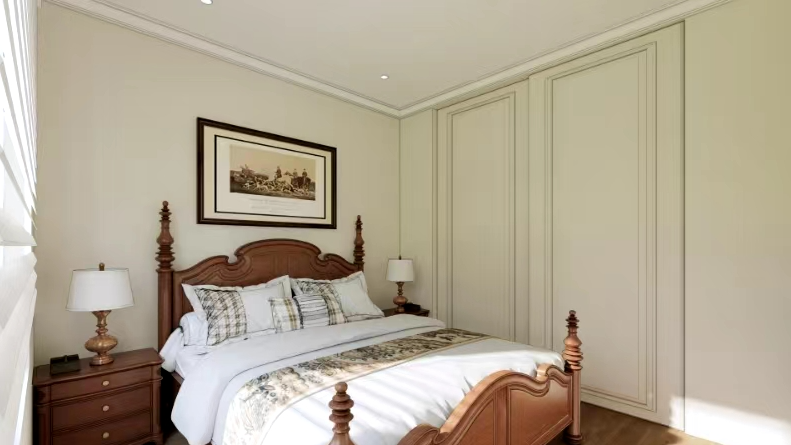 A bedroom with a bed, nightstand, lamps, and a picture on the wall.