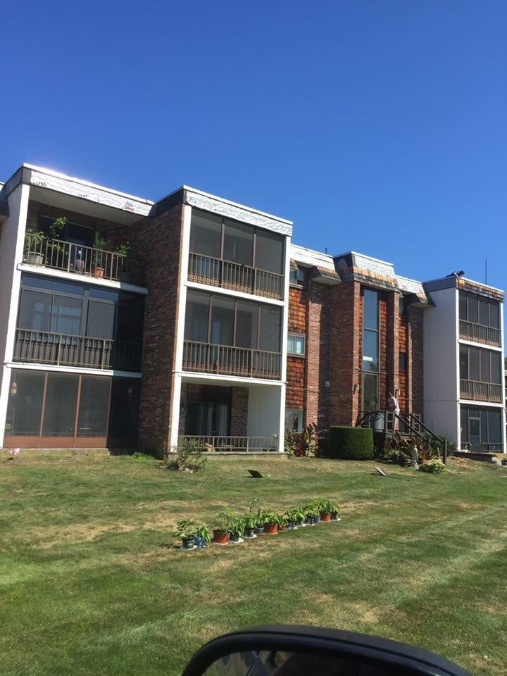 A large apartment building with a lot of windows and balconies