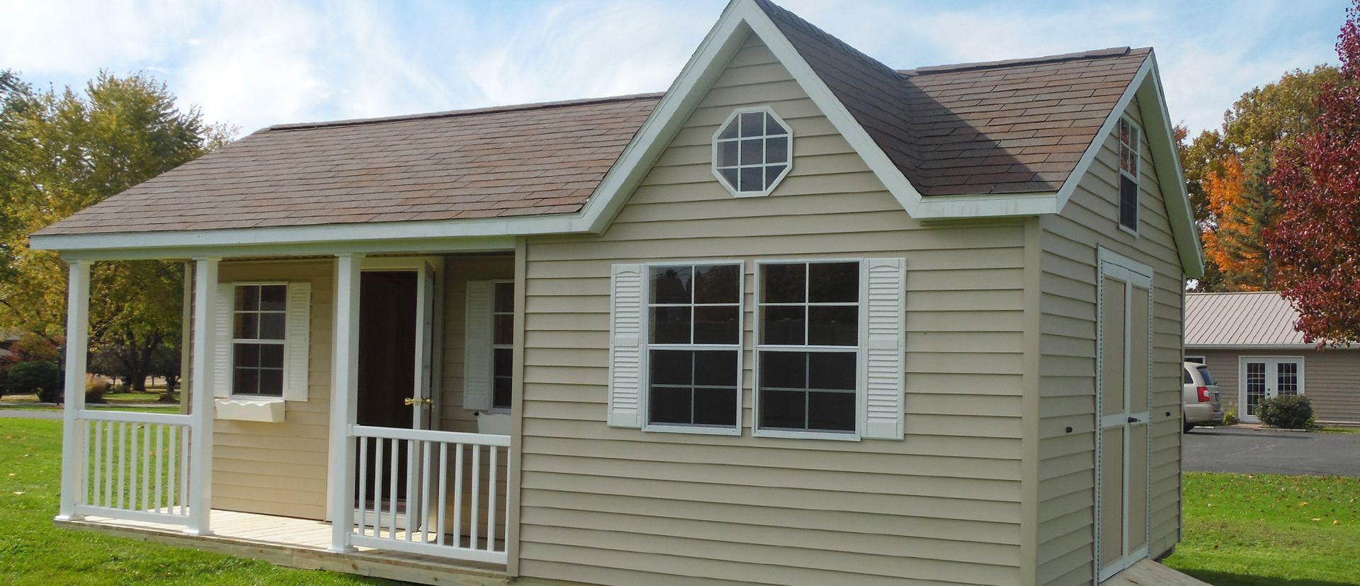 A small house with a porch and a window