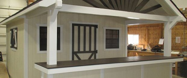 A small house with a porch and a window