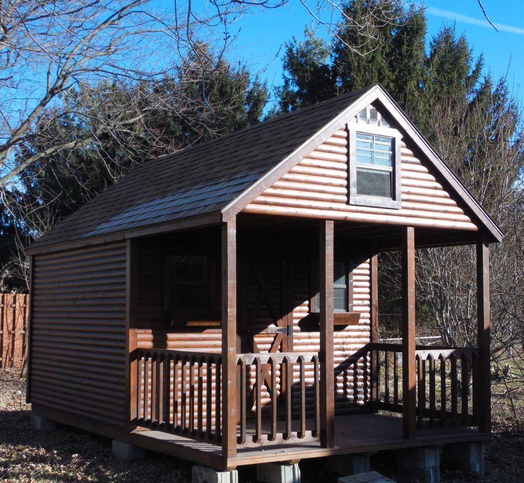 A small house with a porch and a window