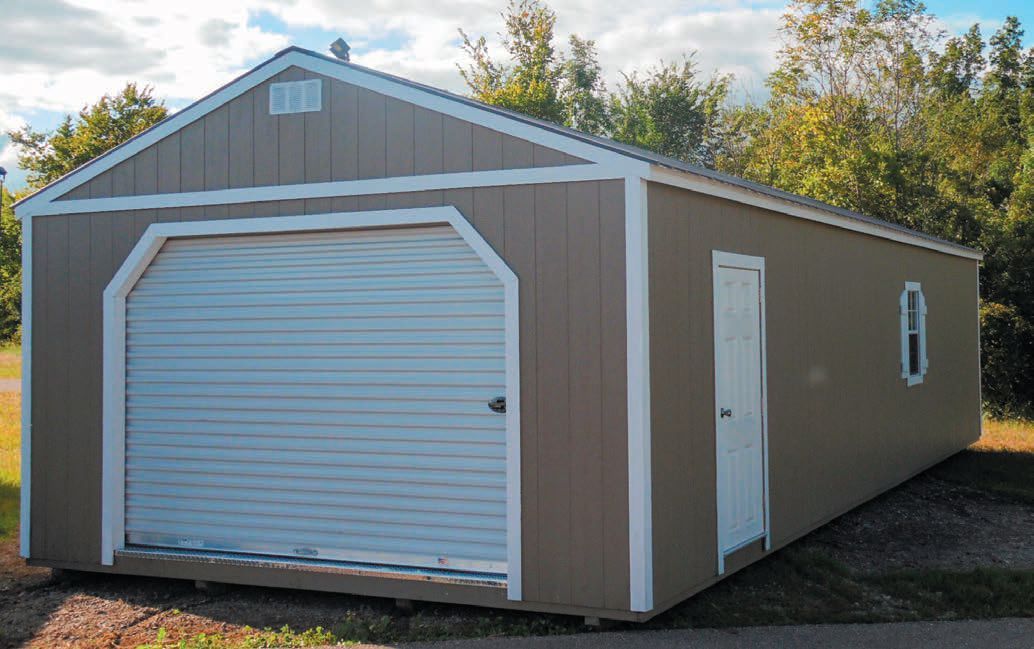 A brown garage with a white door and a window.