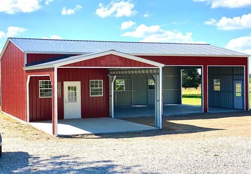 A red barn with a white roof and a white door