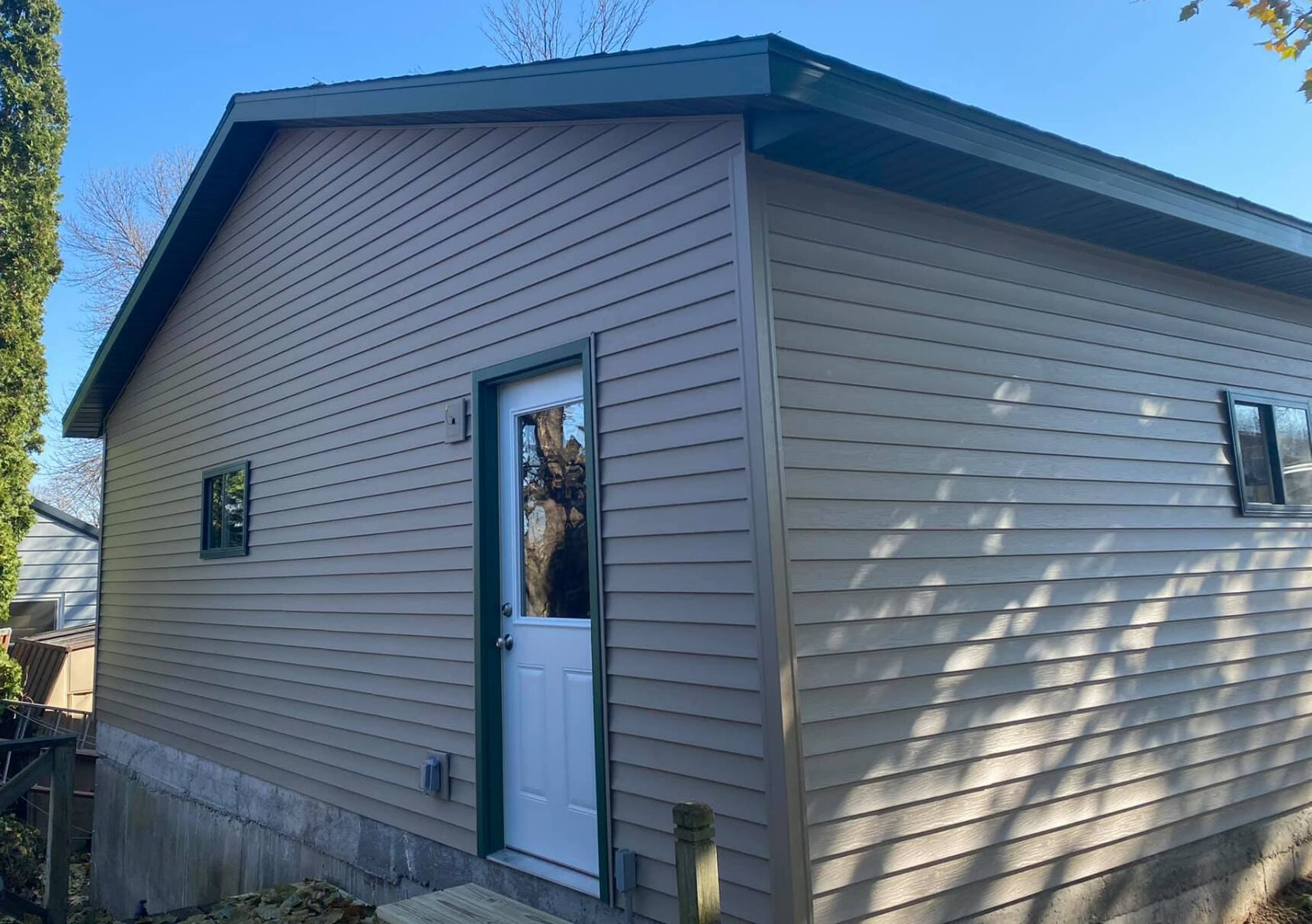 Brown siding with white doors