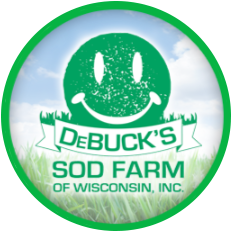 DeBuck's Sod Farm of Wisconsin logo with green smiling face over sky and grass background