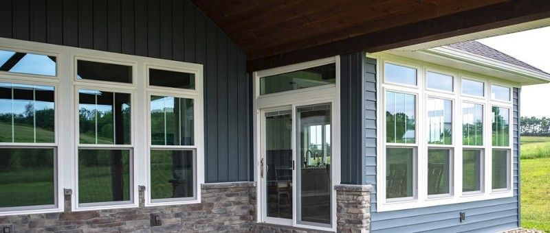 There are a lot of windows on the side of the house.