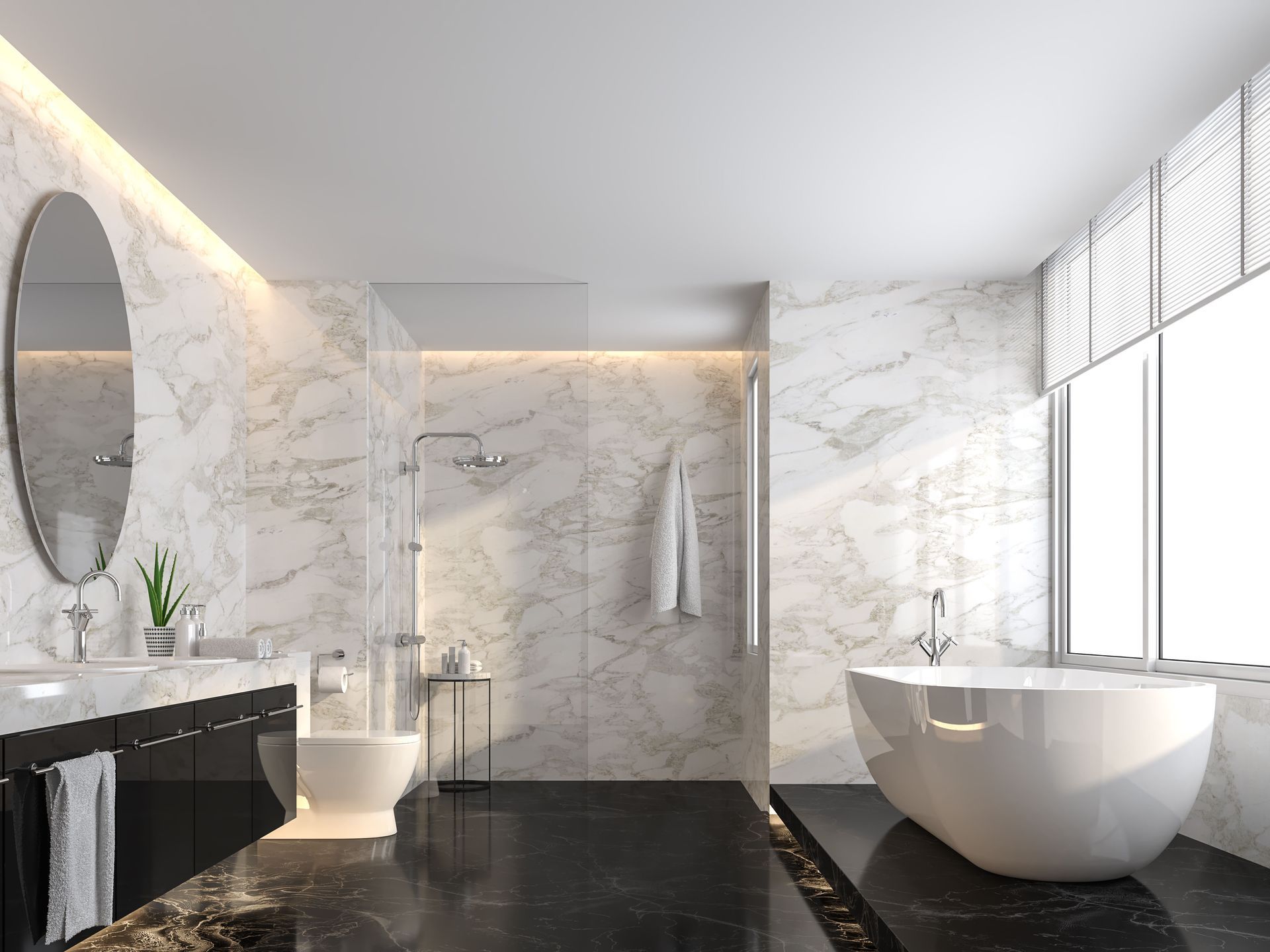 Modern bathroom with marble walls, black floor, and white tub. Includes a toilet, sink, and shower.
