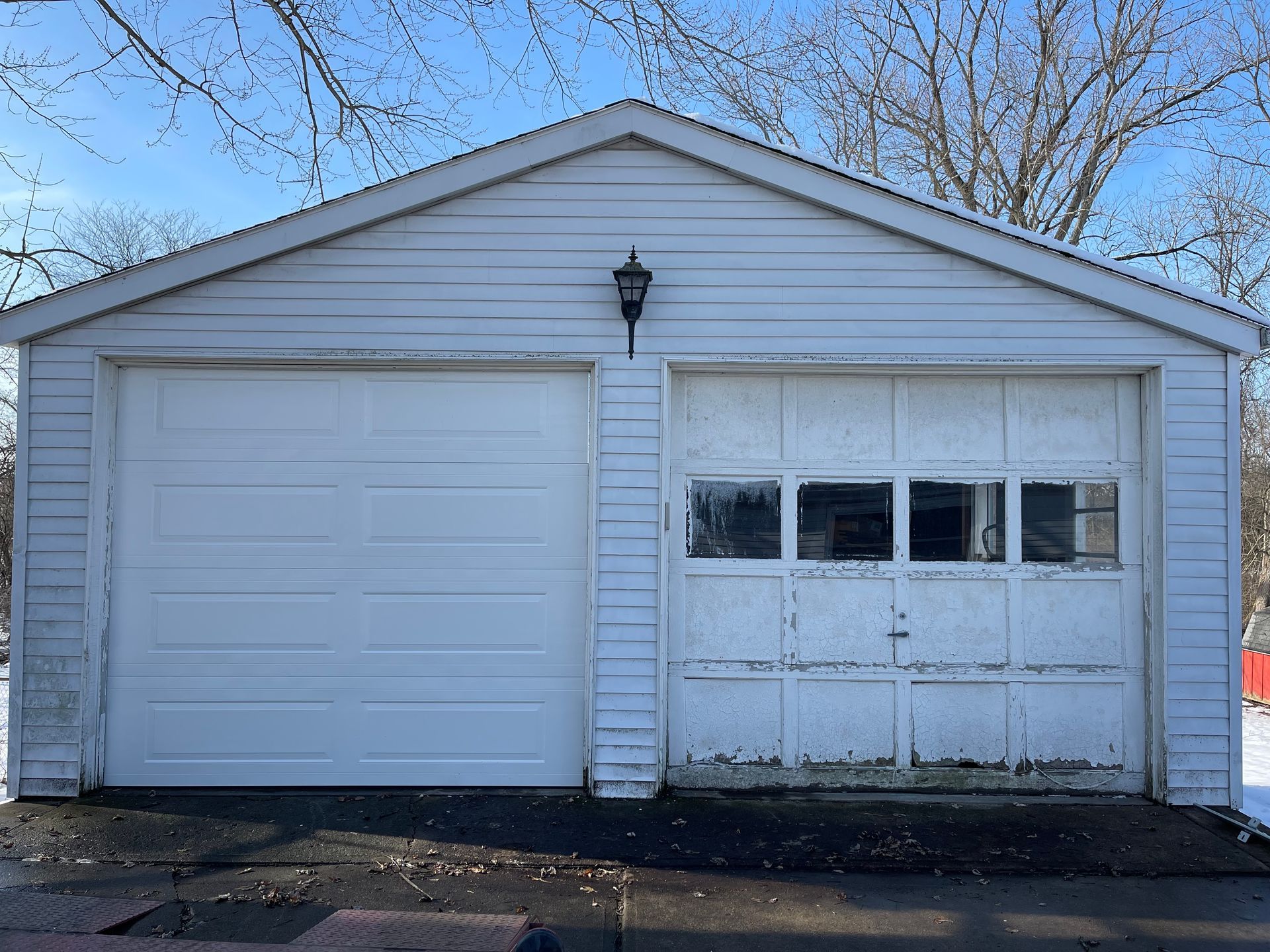 A white garage with a blue sky in the background