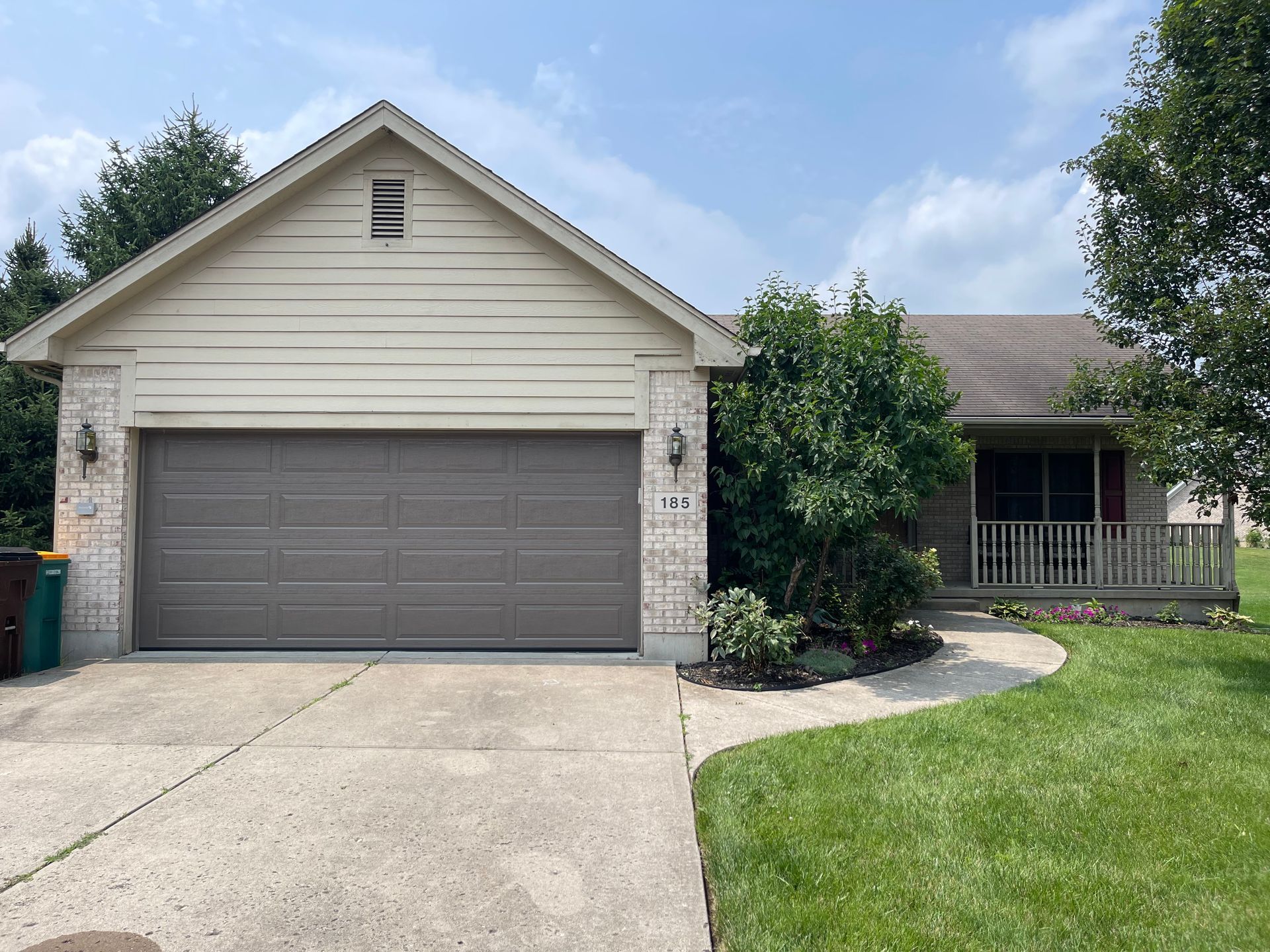 The front of a house with a large garage door