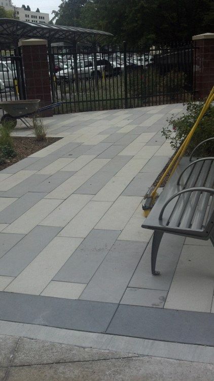 A bench in a park with a yellow measuring tape on it