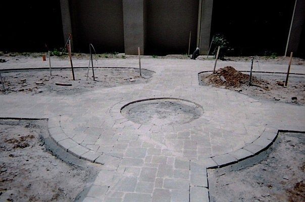 A concrete walkway with a circle in the middle