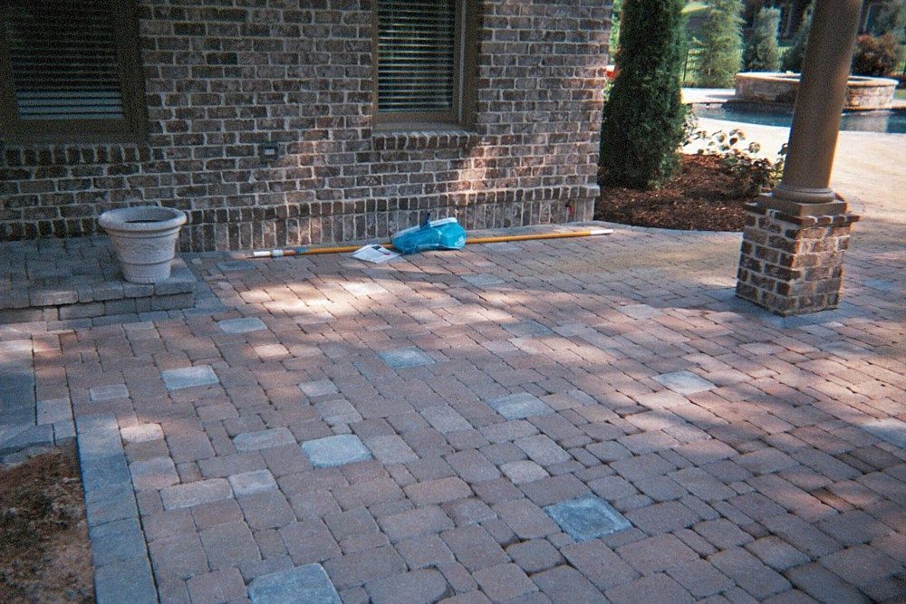 A brick building with a patio in front of it
