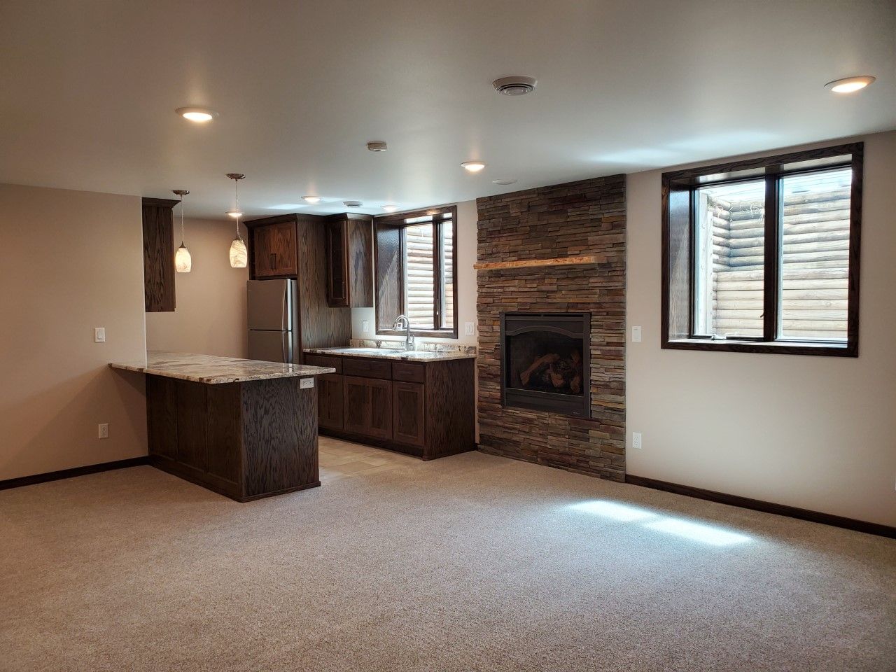 There is a fireplace in the middle of the room