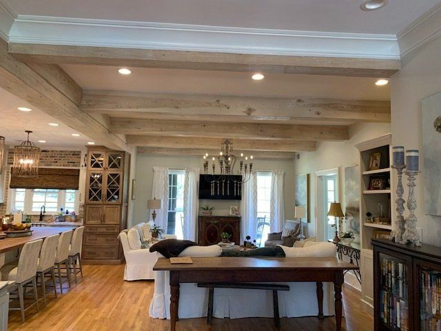 There is a table in the middle of the living room.