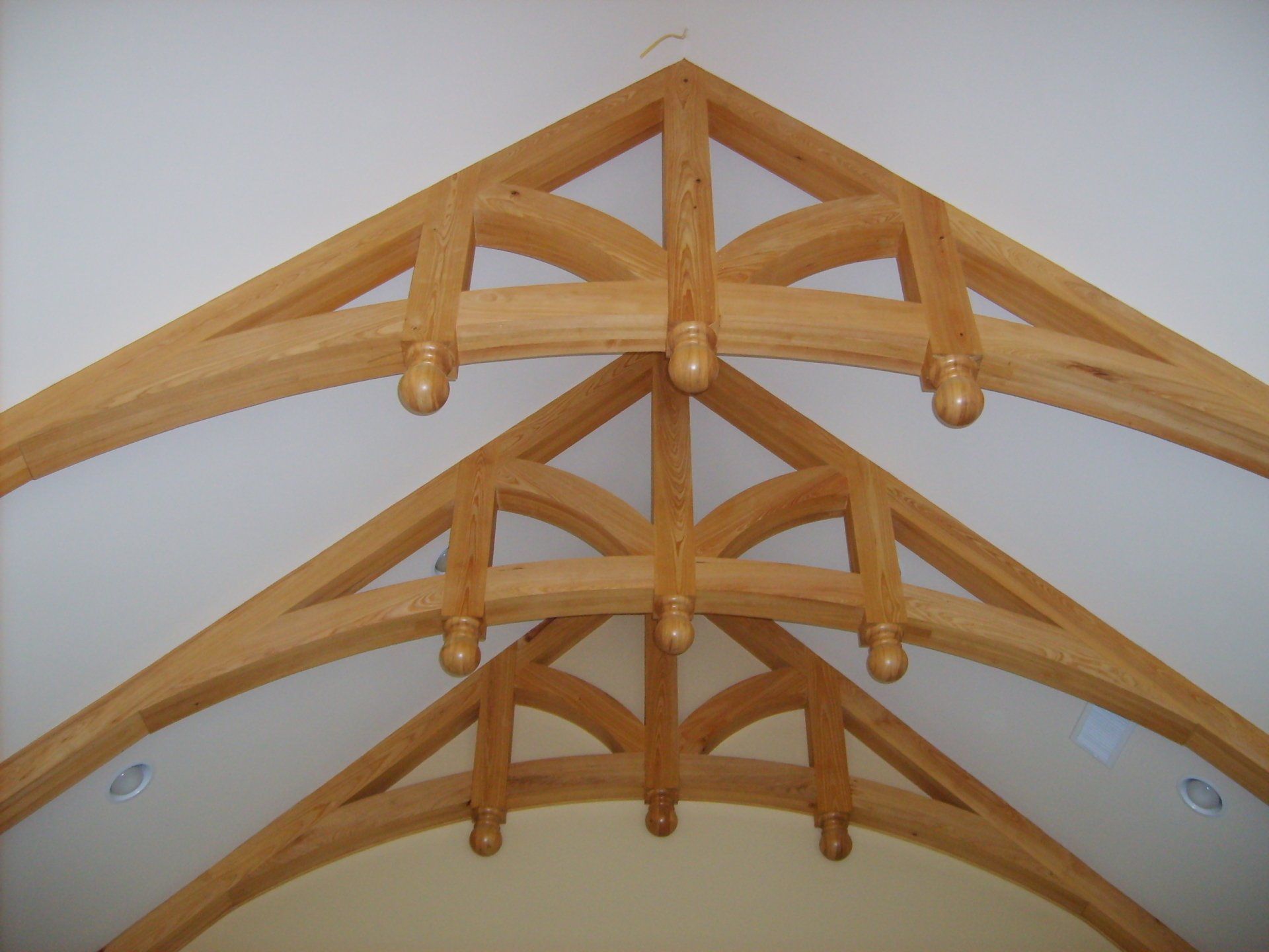 a wooden structure with a white ceiling and a white wall