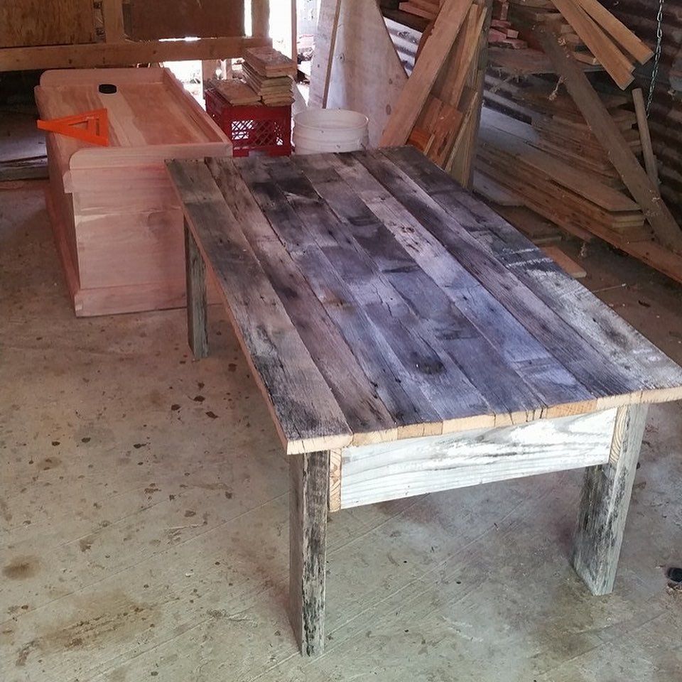 a wooden table in a room with a box