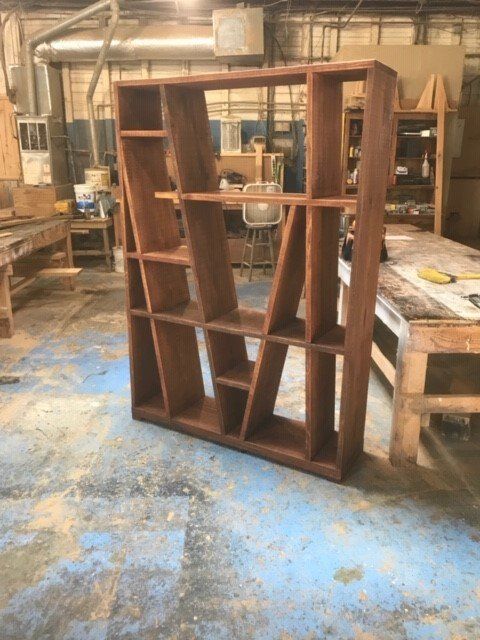 a wooden shelf in a workshop