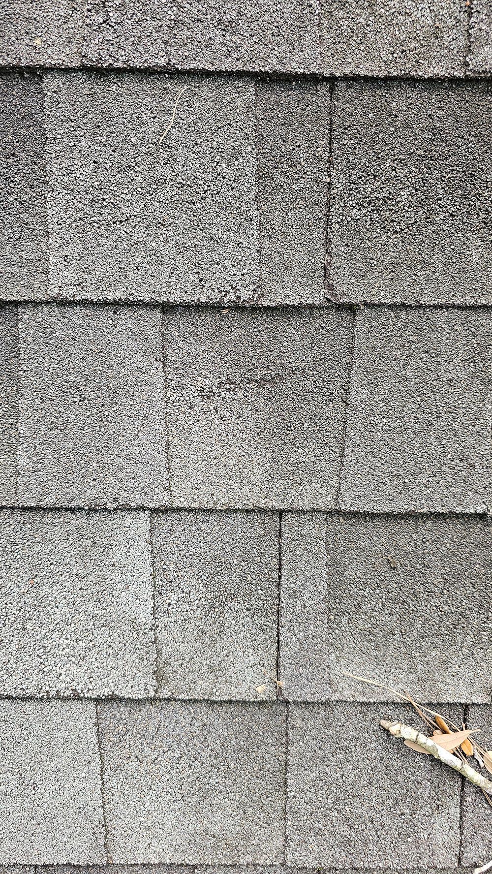 A close up of a roof with shingles on it.