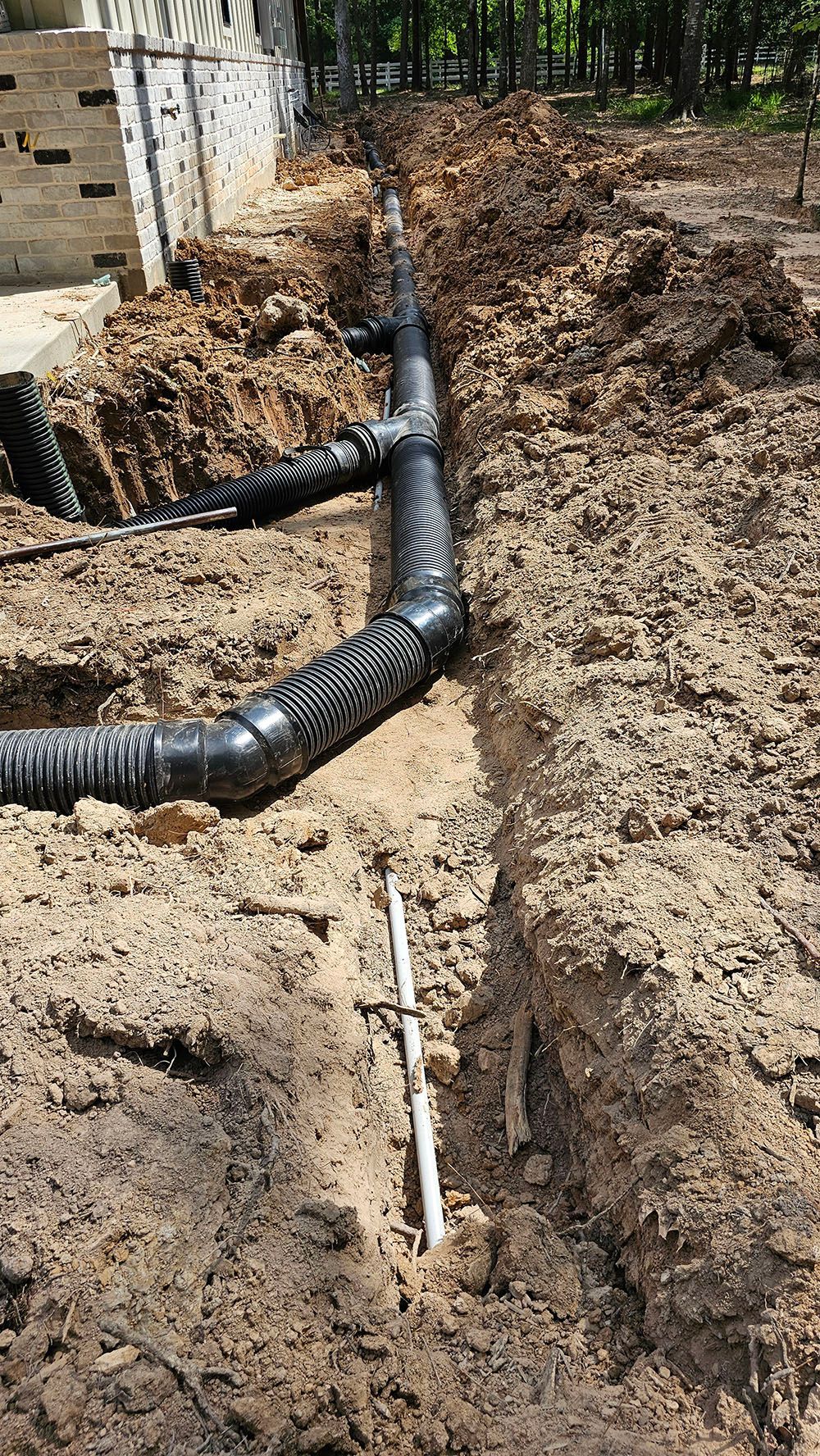 Drainage Systems — Kingwood, TX Drainage system installation in Kingwood, TX by Orion’s Rain