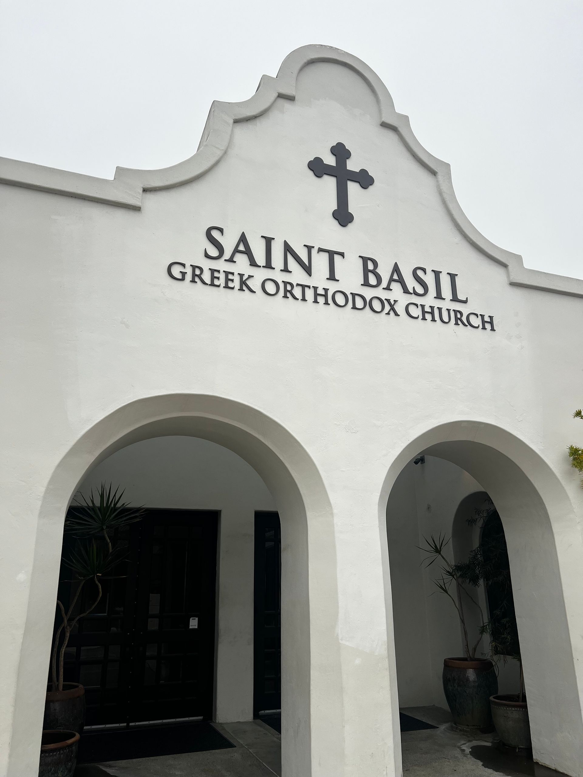 The saint basil greek orthodox church is a white building