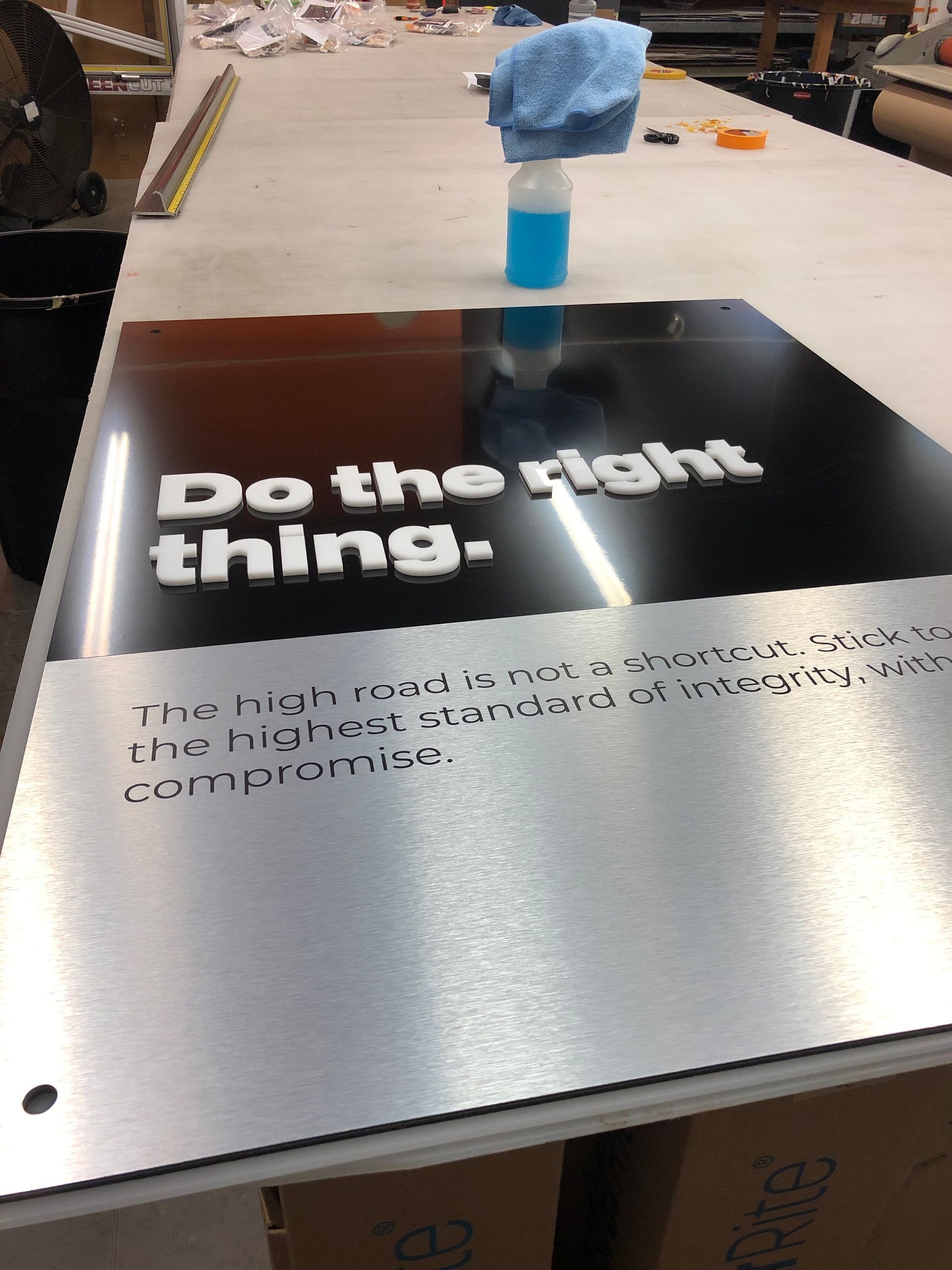 A sign on a table that says do the right thing