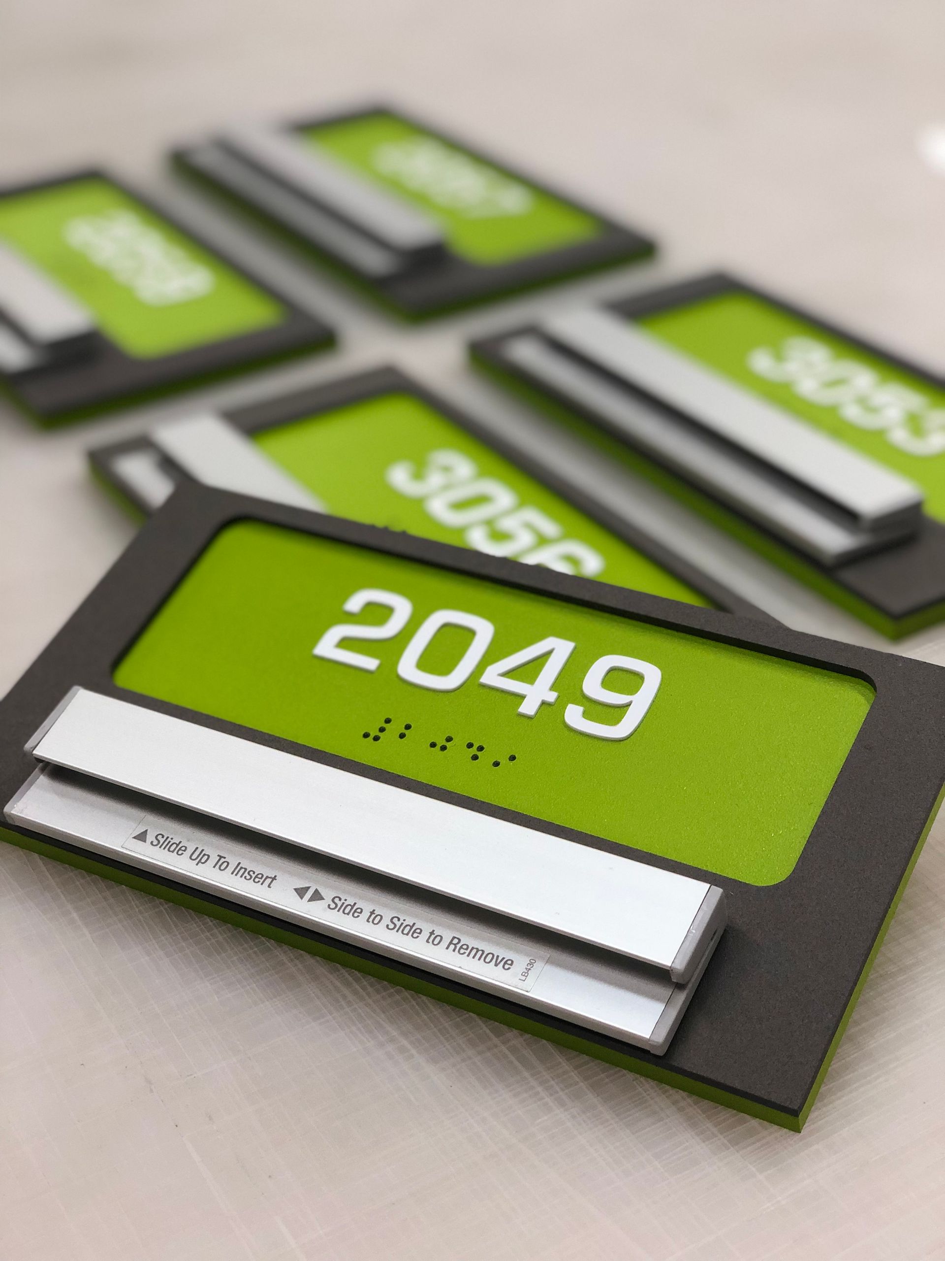 A green sign with the number 2049 on it