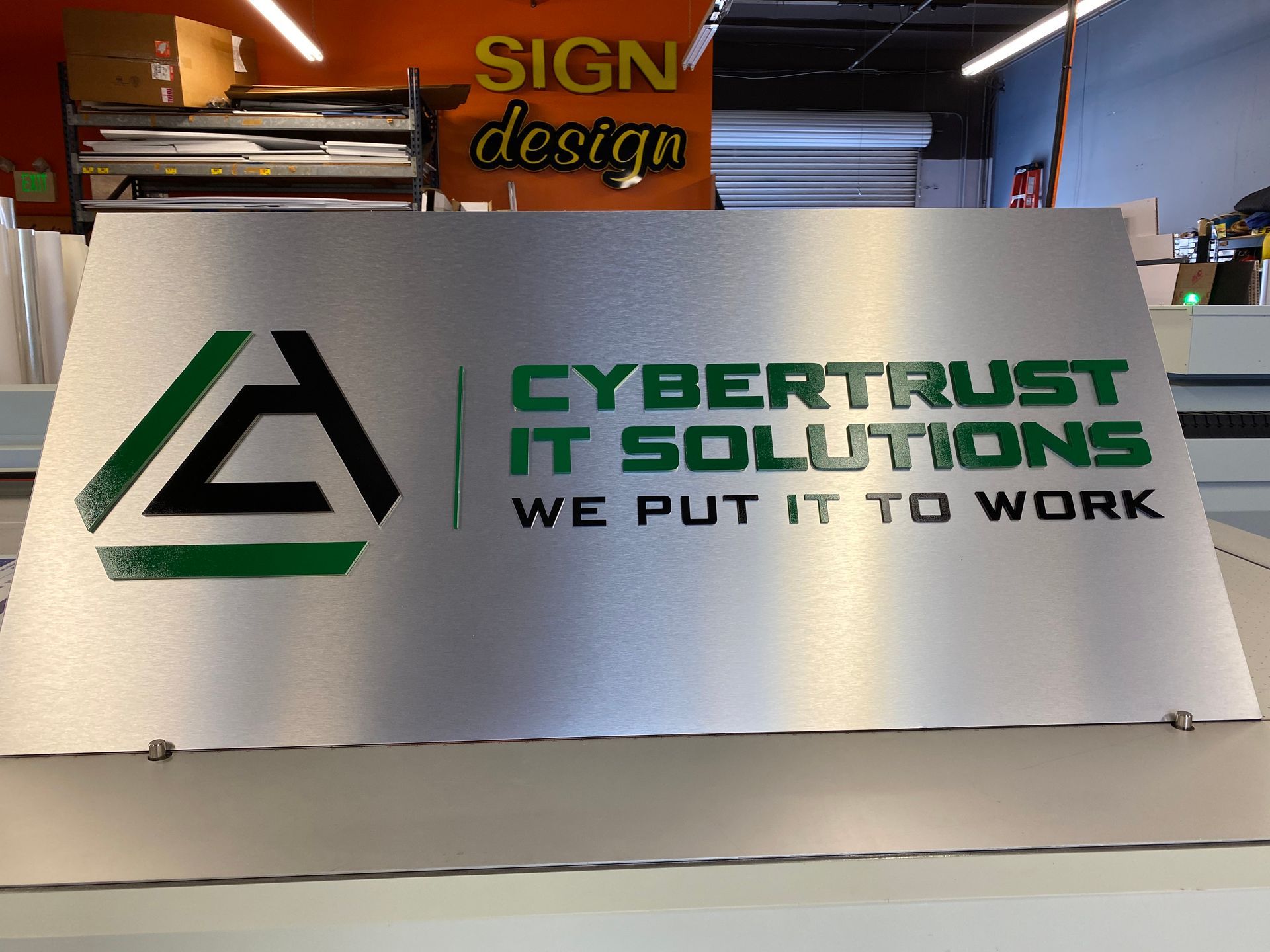 A sign that says cybertrust it solutions we put it to work