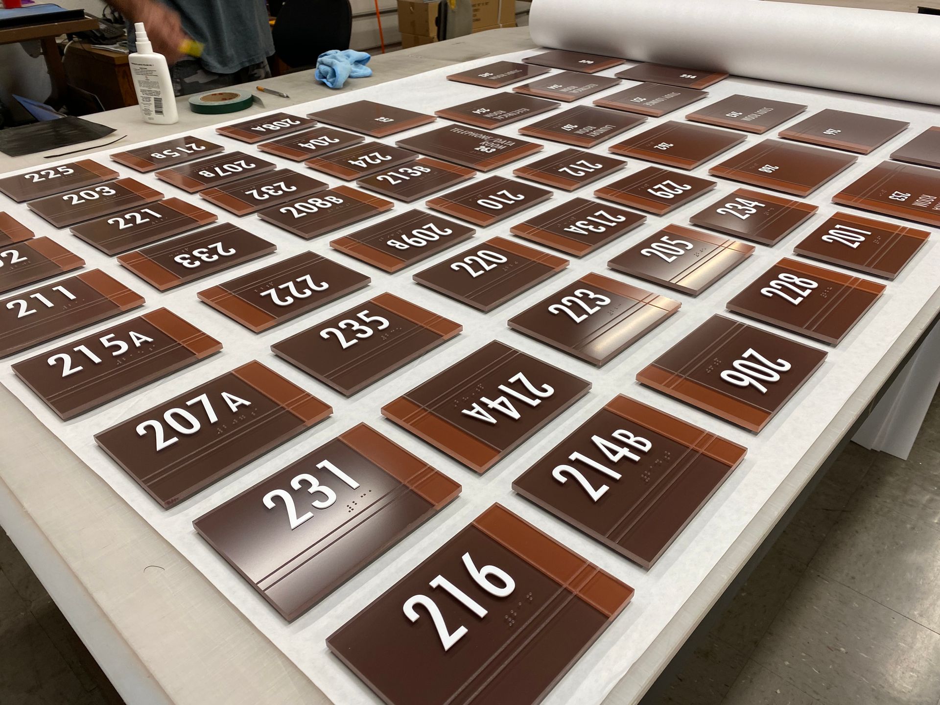 A table topped with a bunch of signs with numbers on them.