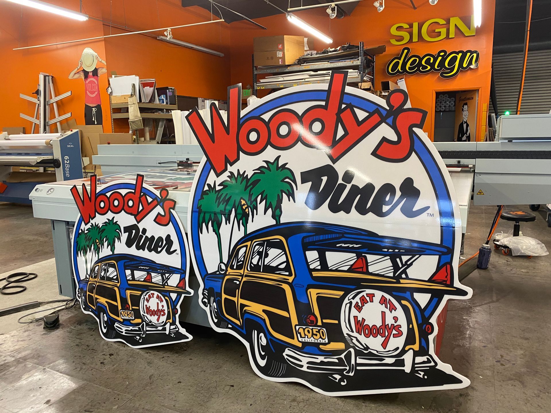 A woody 's diner sign is sitting on a table