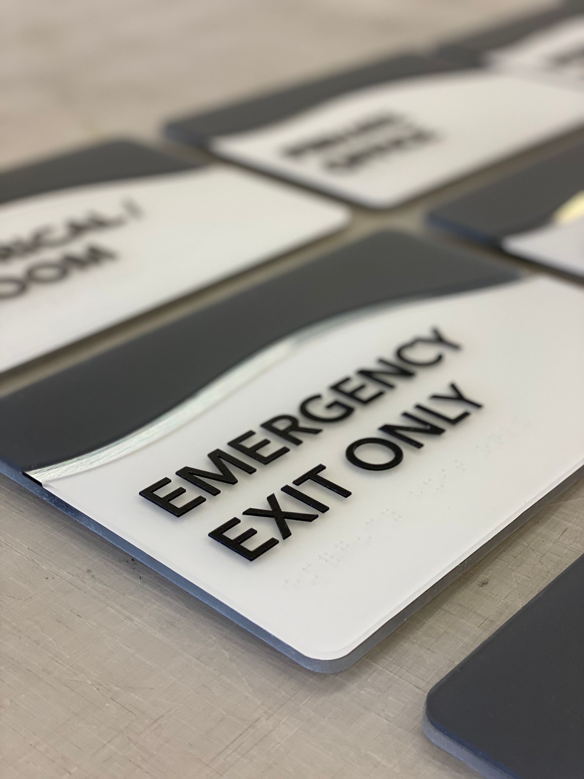 A sign that says emergency exit only on it