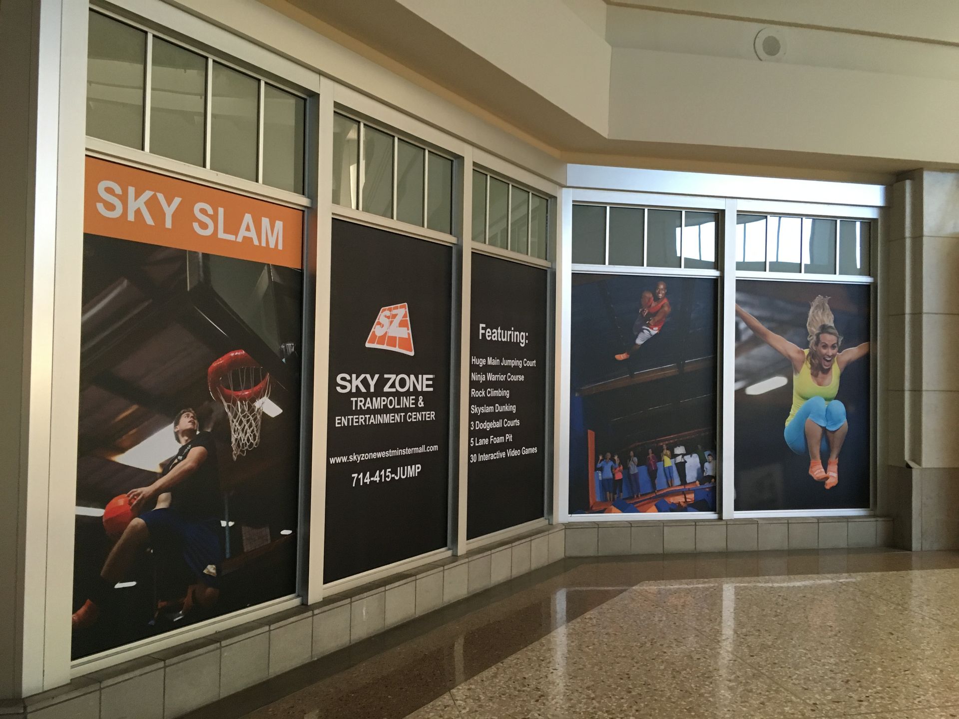 A building with a sign that says sky slam on it