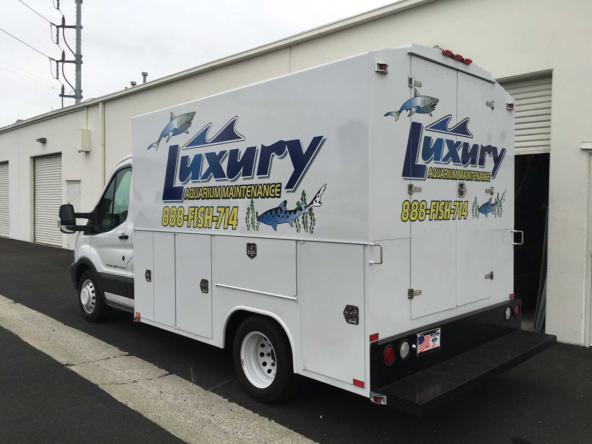 A white van with the word luxury on it