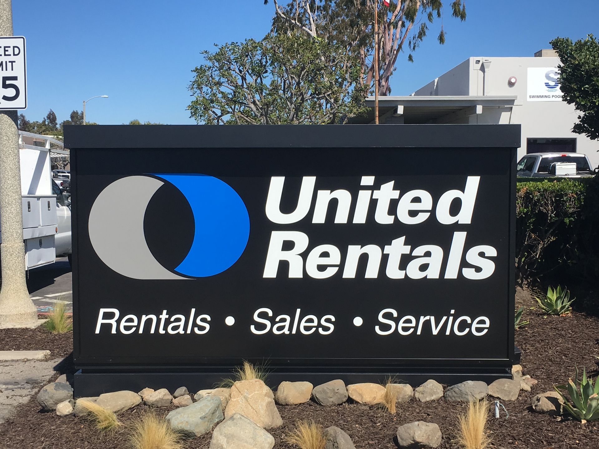 A sign for united rentals rentals sales and service
