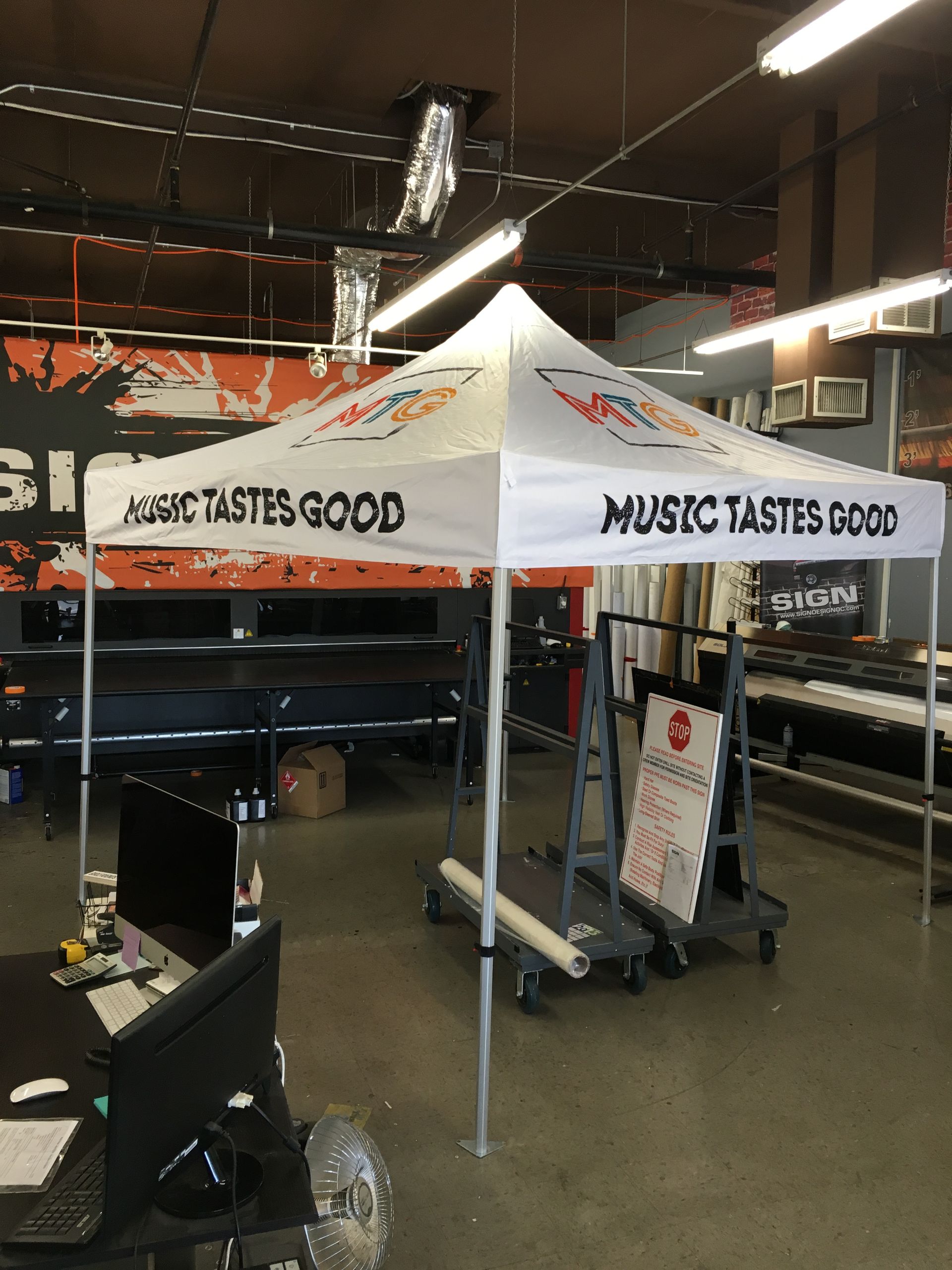 A white tent with the words music tastes good on it