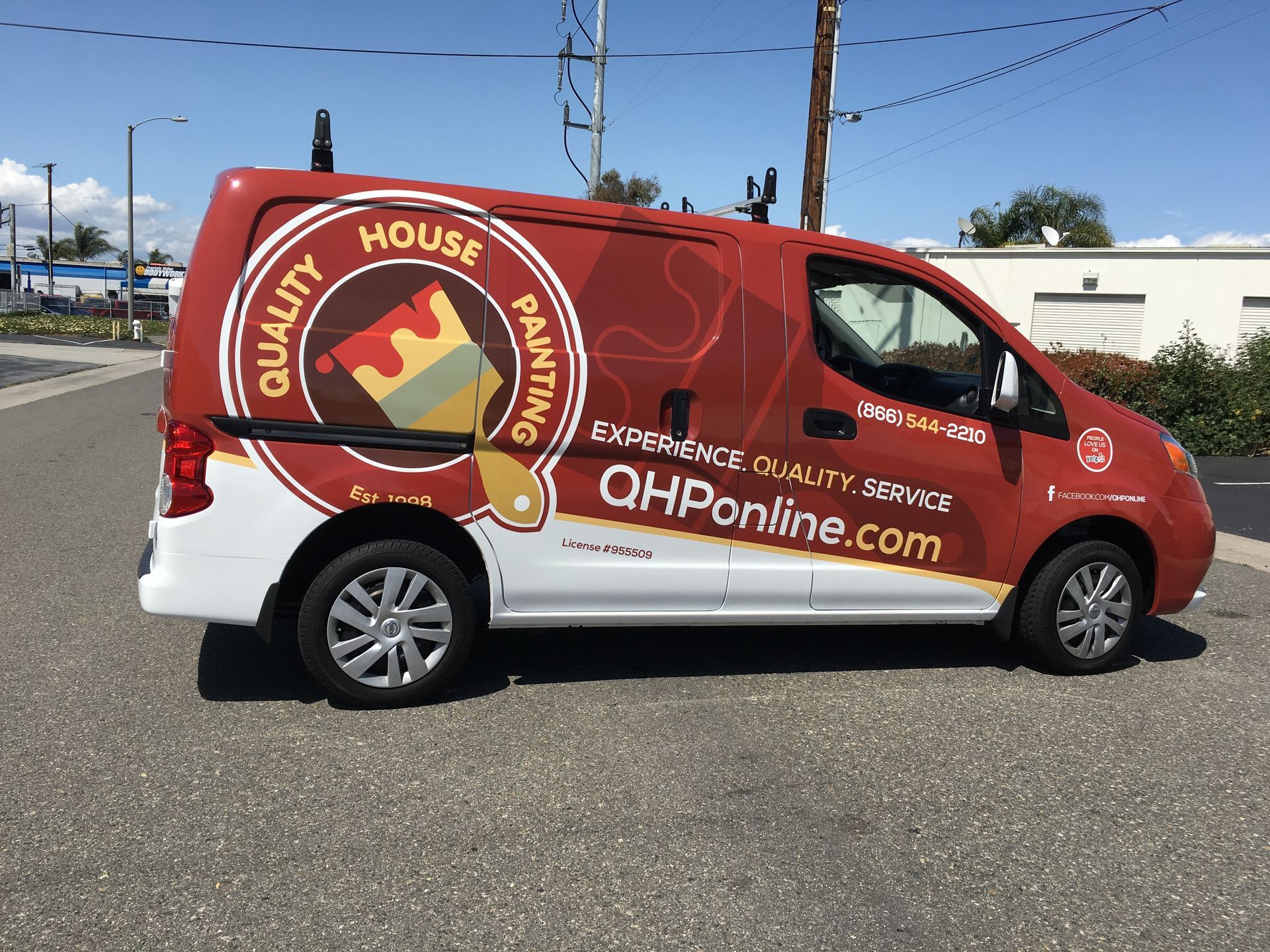 A red van that says quality house painting on it