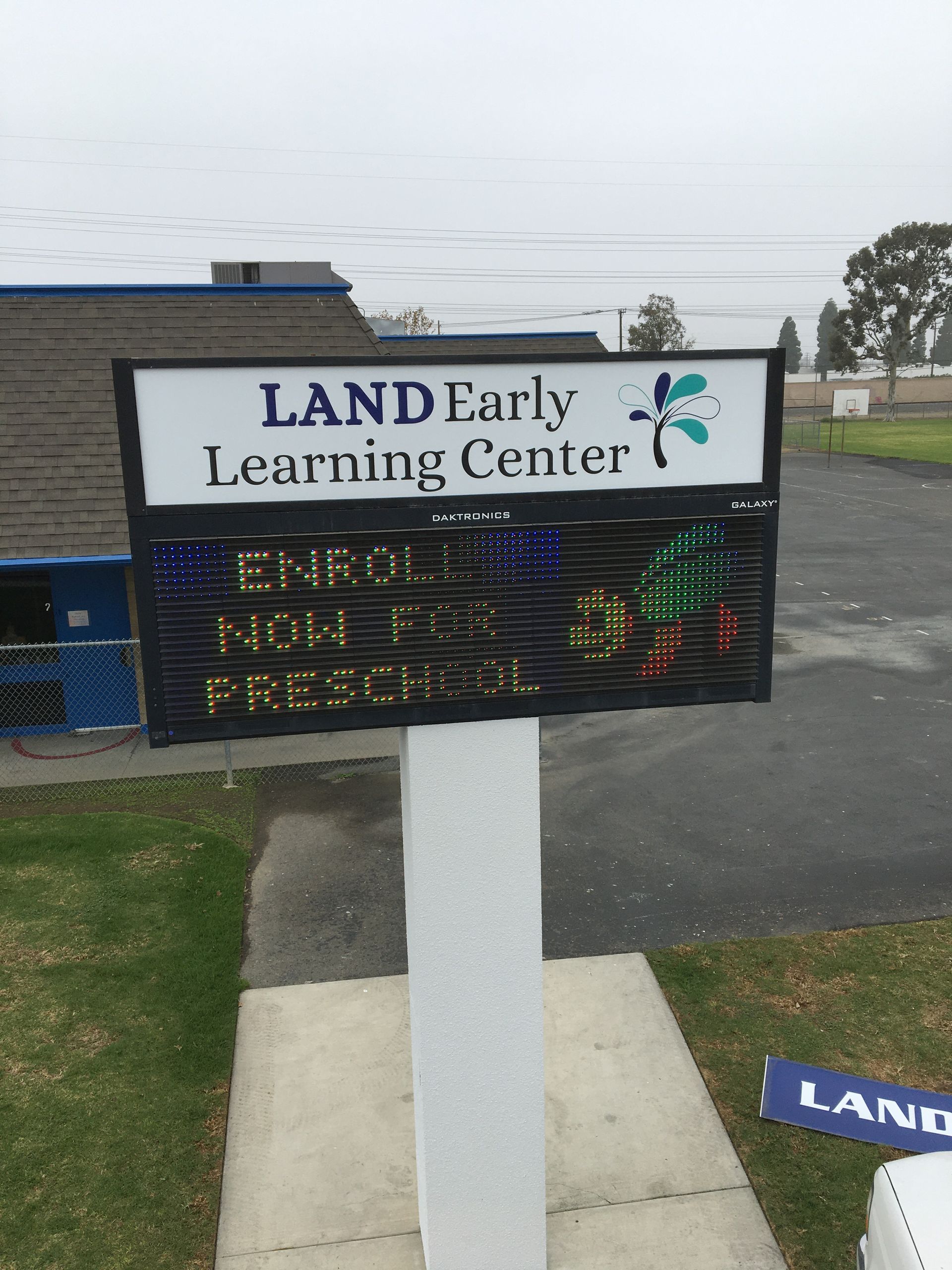 A sign that says land early learning center on it
