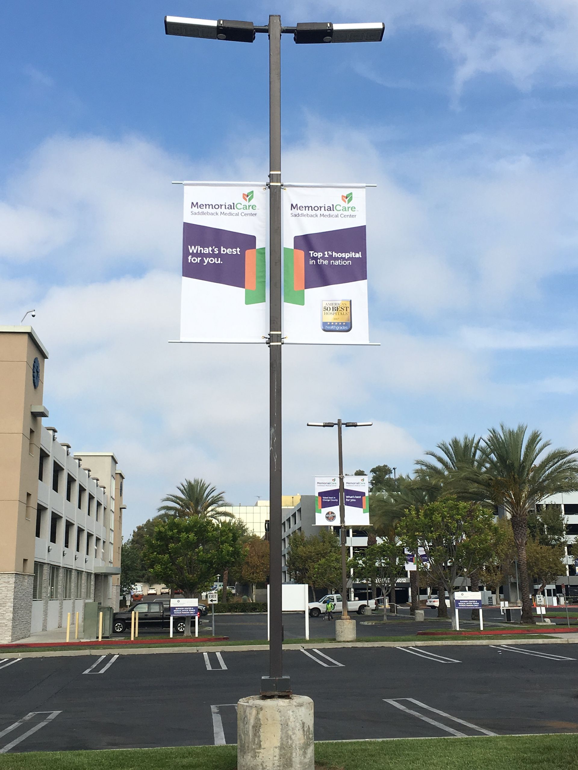 A street light with two banners hanging from it