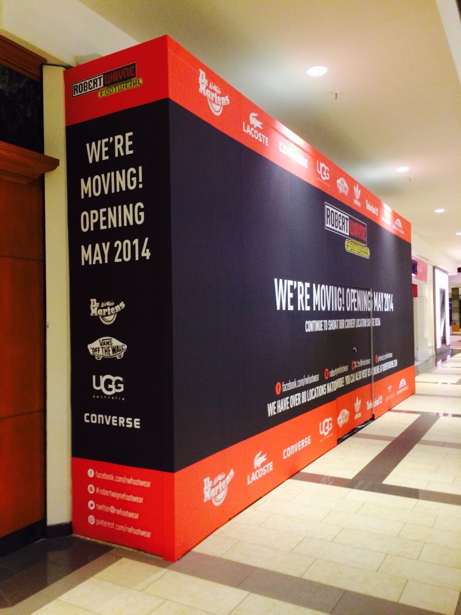 A large sign that says we 're moving opening may 2014