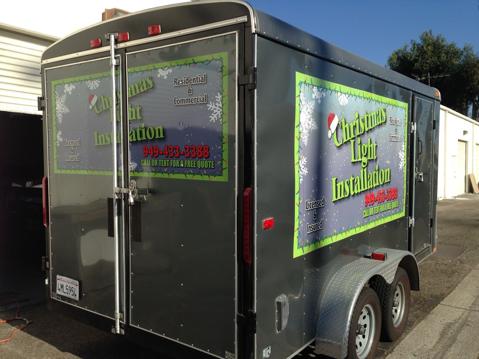 A trailer that says christmas light installation on it