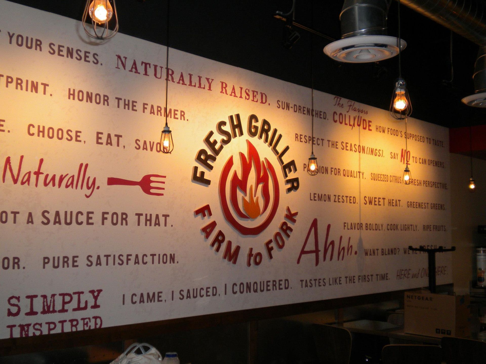 A sign for fresh griller farm to fork says