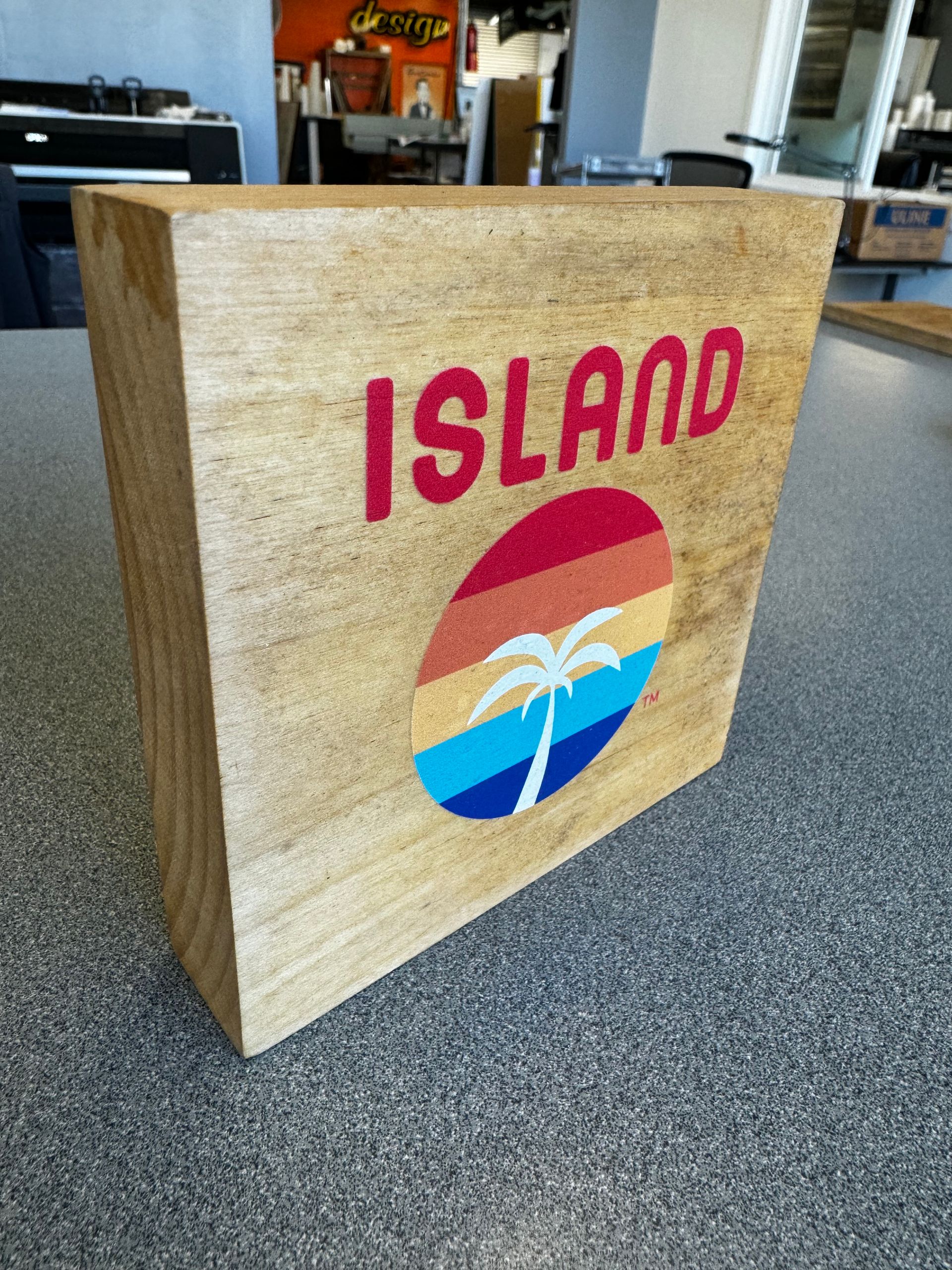 A wooden box with the word island on it